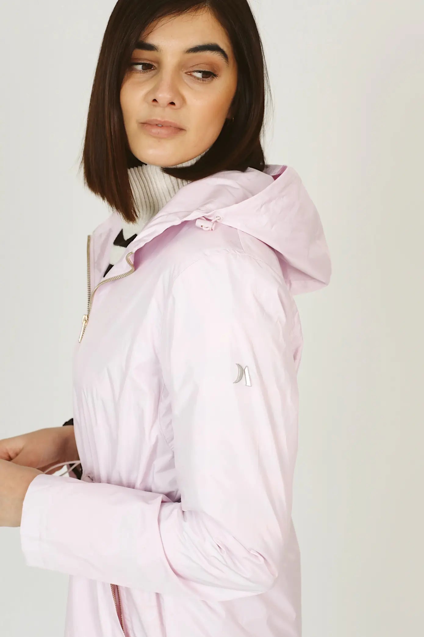 Rosewater Mist pastel pink hooded raincoat, modern lightweight waterproof raincoat perfect for wet weather in Australia.