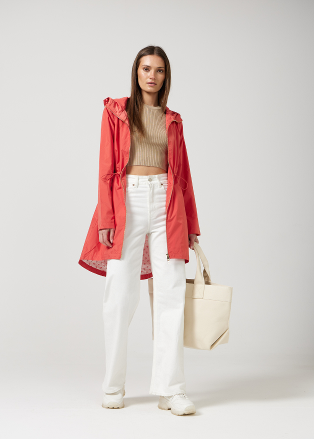 The Coral Spritz coral red hooded raincoat, modern lightweight waterproof raincoat perfect for Australia’s changing weather and rain