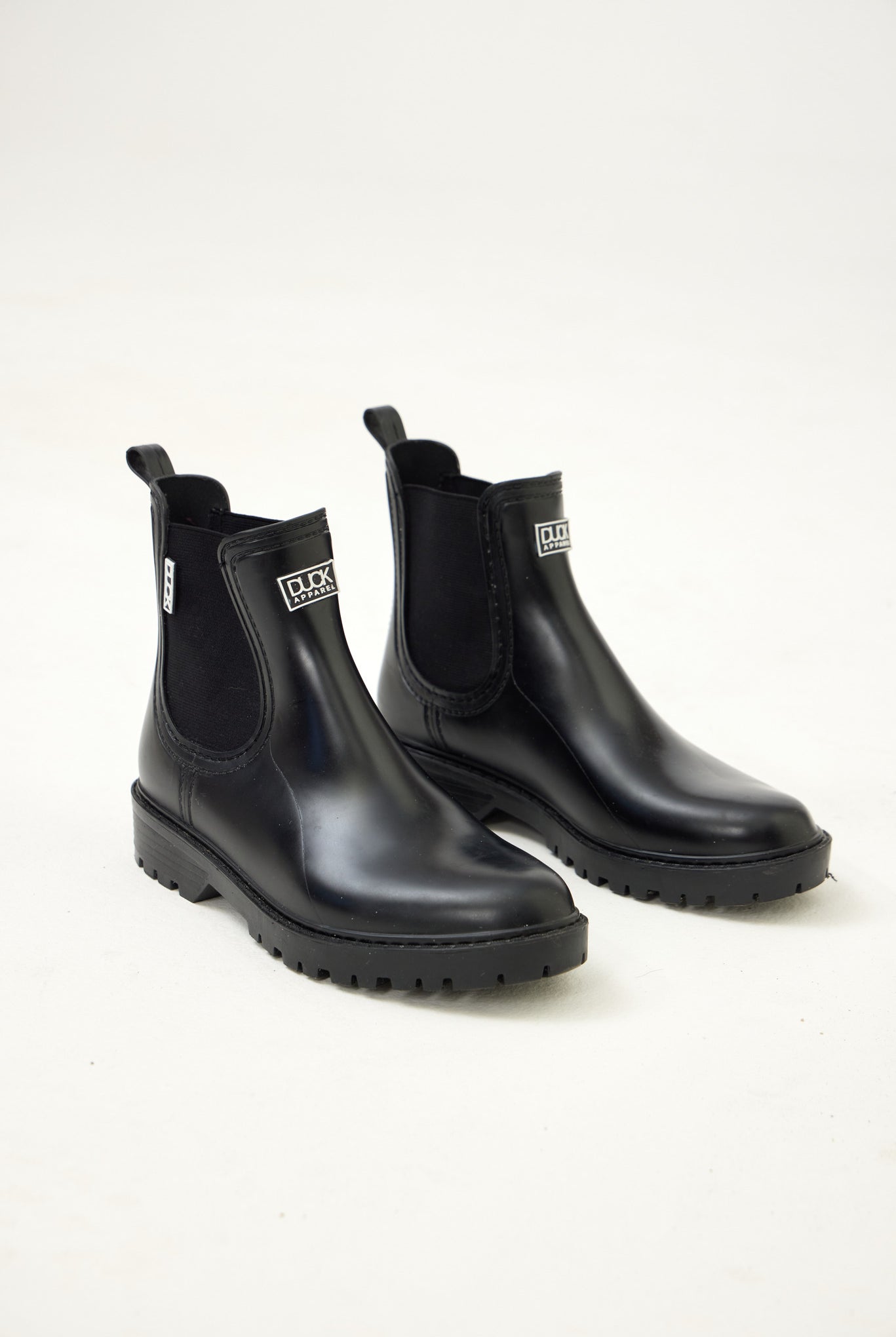 Black Ankle-length gumboots with elastic side panels and durable sole, designed for everyday outdoor and wet-weather use