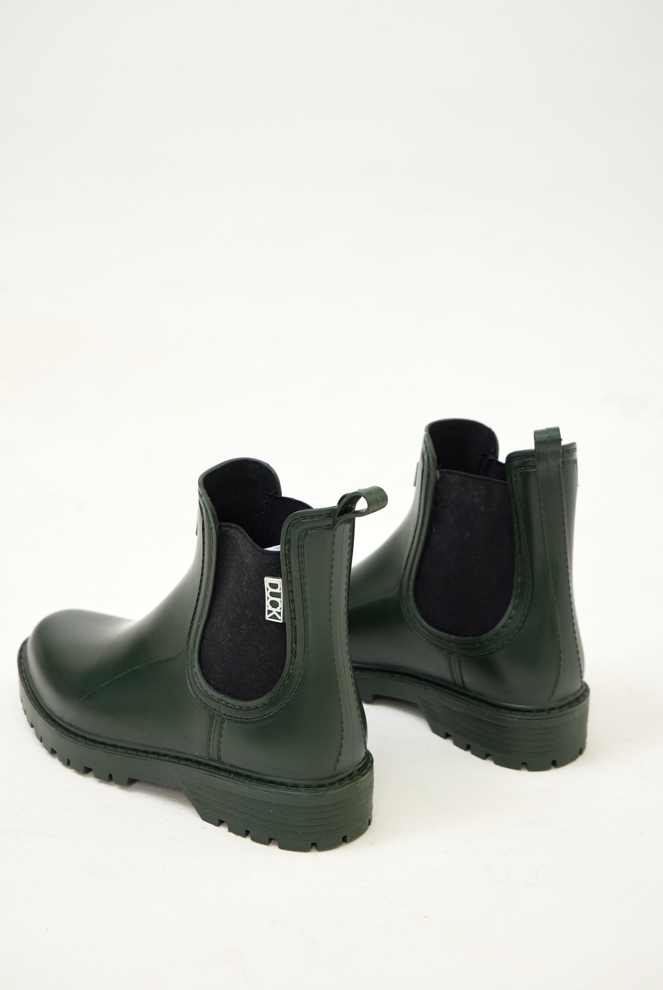 Green Ankle-length gumboots with elastic side panels and durable sole, designed for everyday outdoor and wet-weather use
