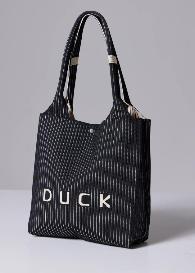 The Duck™ black woven tote bag with white pinstripes, sustainable fabric shopper with embroidered DUCK logo, reusable eco-friendly tote for everyday use
