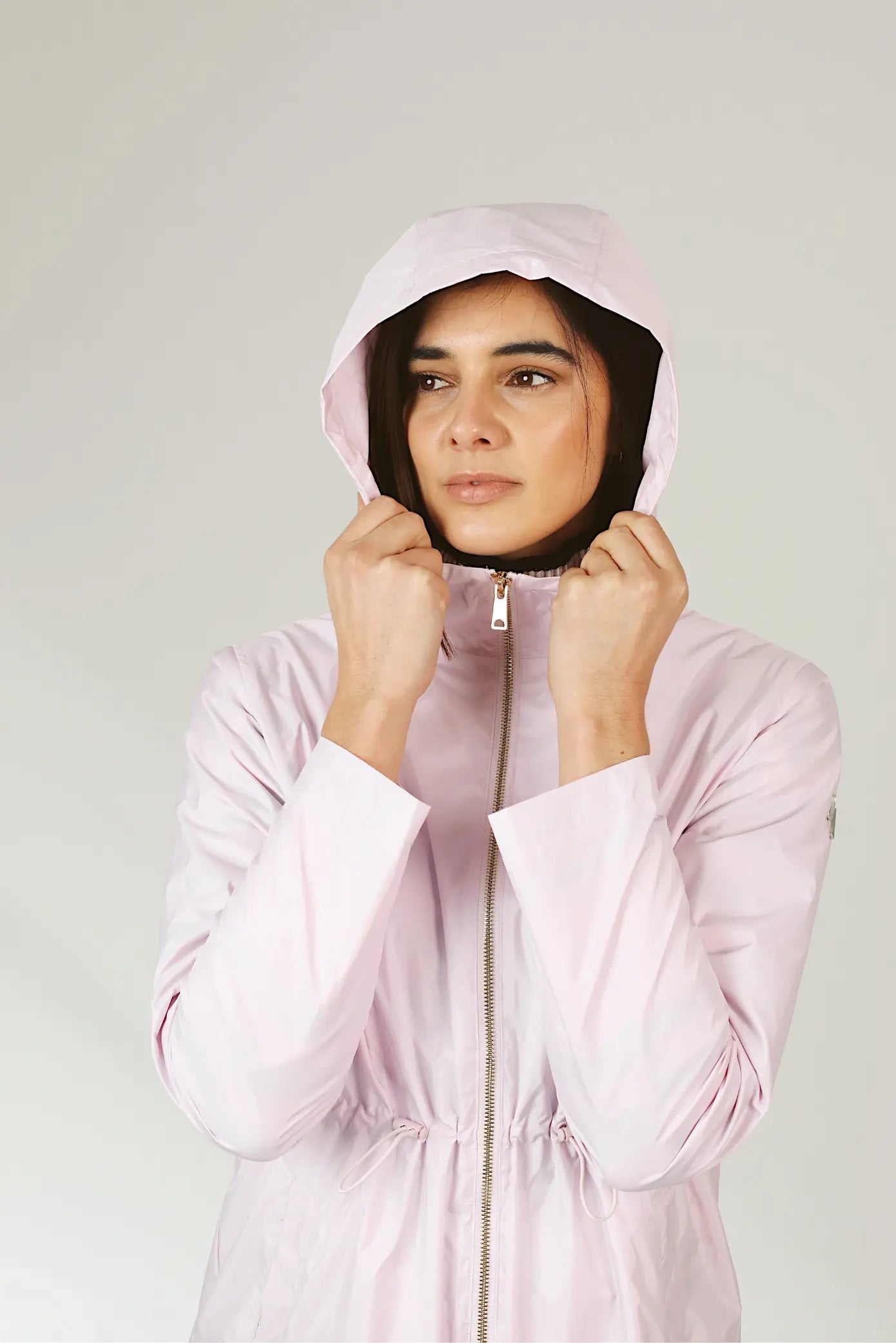 Rosewater Mist pastel pink hooded raincoat, modern lightweight waterproof raincoat perfect for wet weather in Australia.