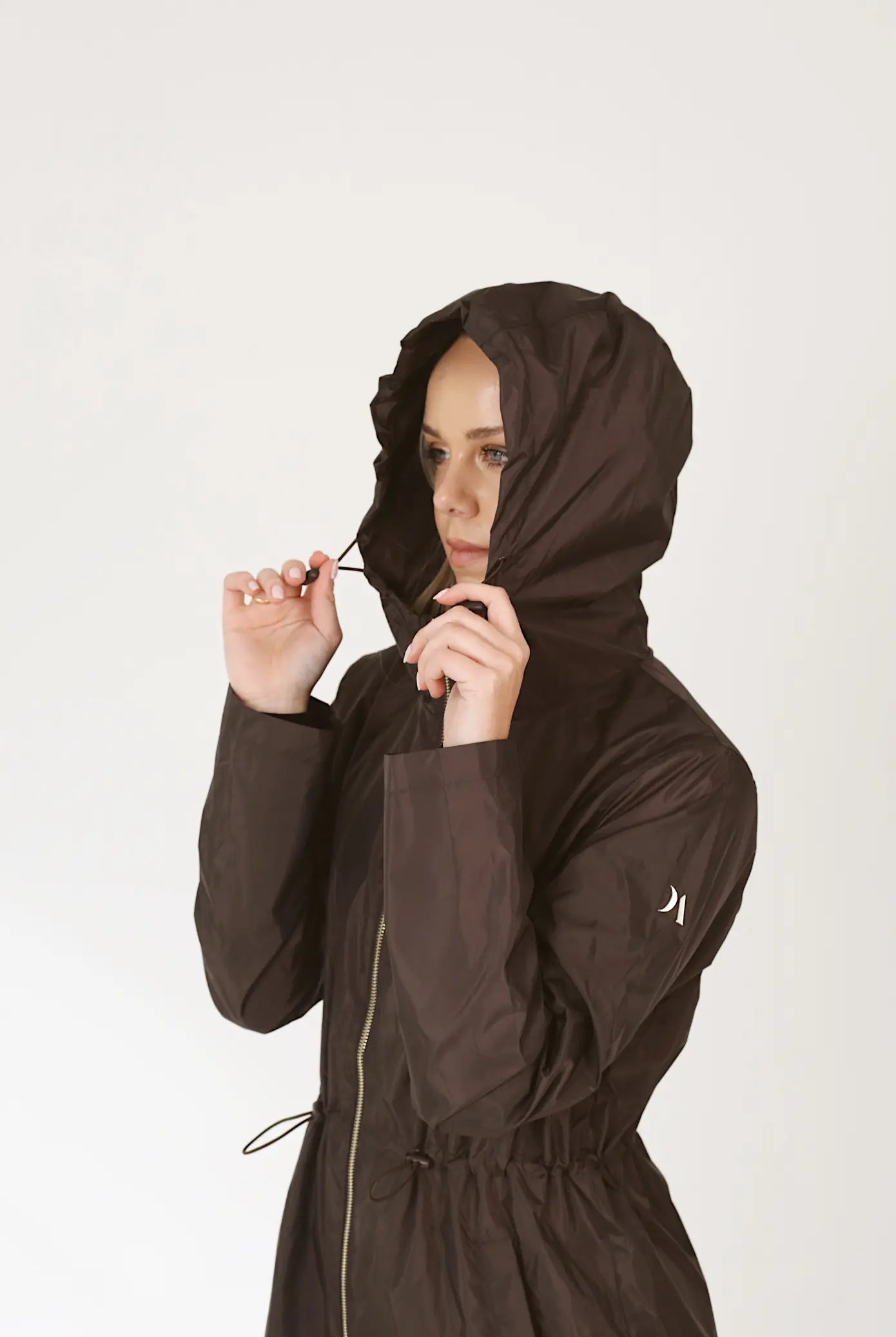 Truffle Haze dark brown hooded raincoat, modern lightweight waterproof raincoat perfect for Australia’s changing weather and rain