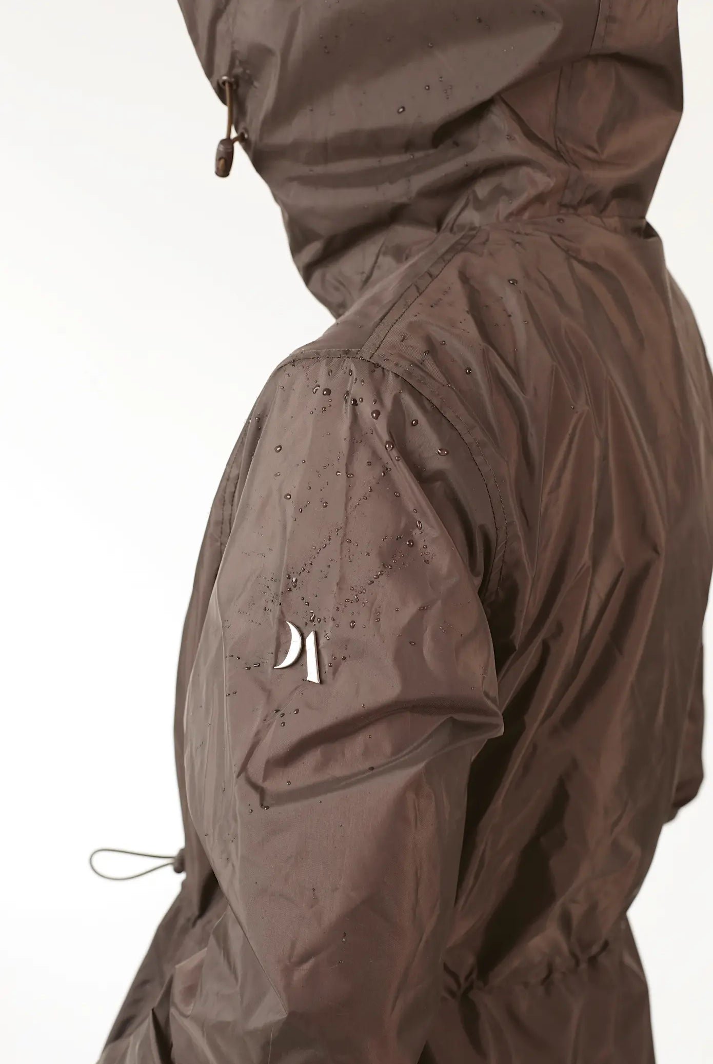 Truffle Haze dark brown hooded raincoat, modern lightweight waterproof raincoat perfect for Australia’s changing weather and rain