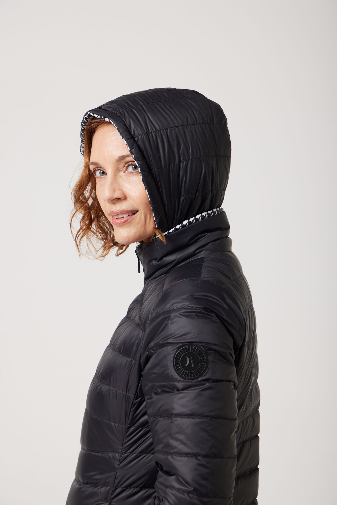 Women’s houndstooth print and midnight black reversible insulated parka with hood, warm winter parka perfect for layering in Australia’s cooler weather — Midnight x Houndstooth Classic Parka™