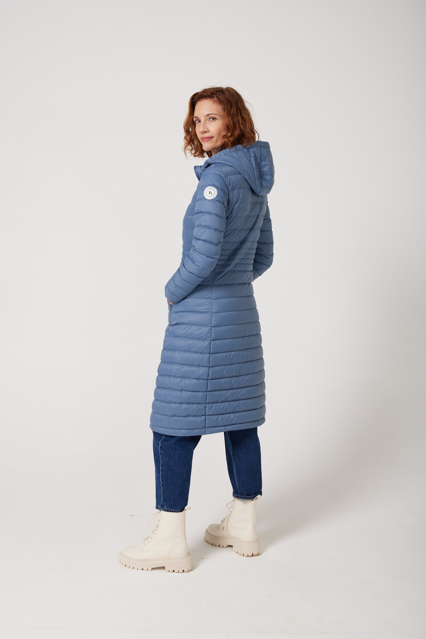 Women’s sky blue insulated ultra parka with hood, long warm winter jacket perfect for layering in Australia’s cooler weather — Vista Ultra Parka™