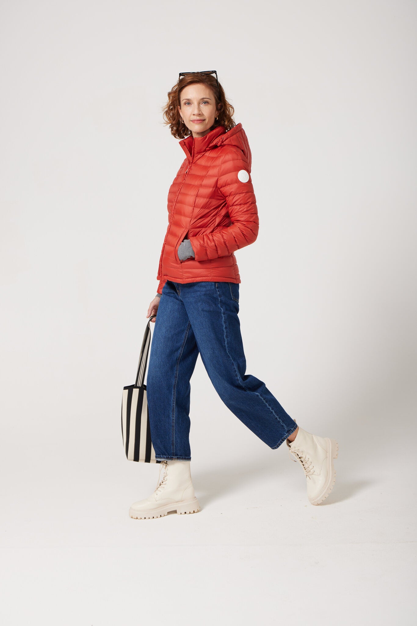 Women’s Rust Classic Jacket™ in vibrant red, stylish lightweight puffer jacket for everyday wear and seasonal outerwear in Australia