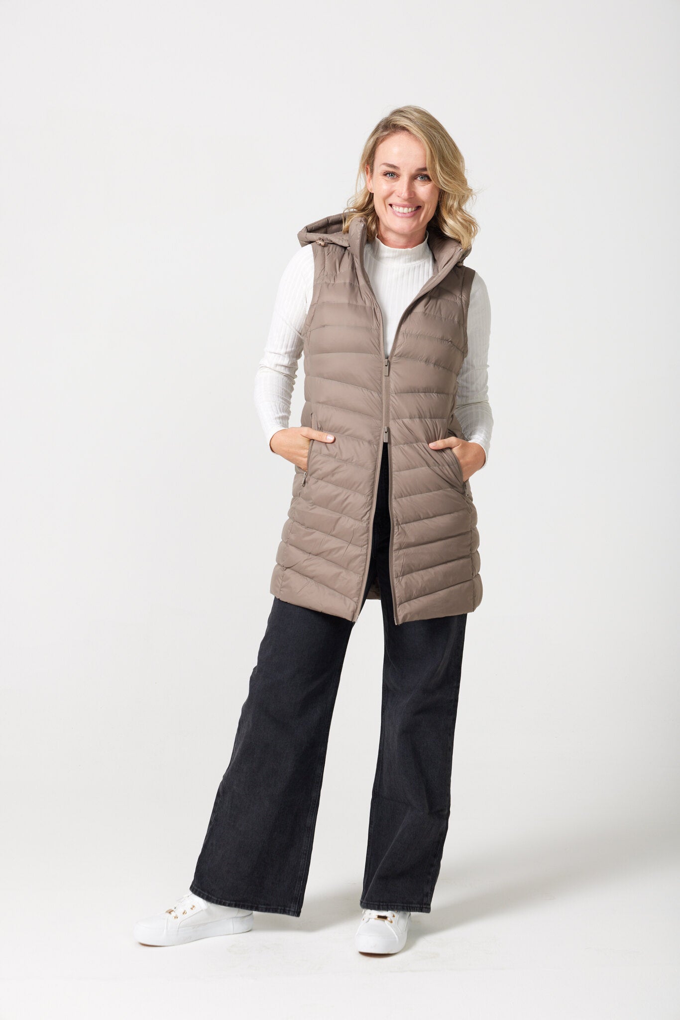 Chai Longline Gilet™ — women’s sleeveless quilted puffer vest in chai brown, extended longline cut with hood, perfect for versatile layering in Australia