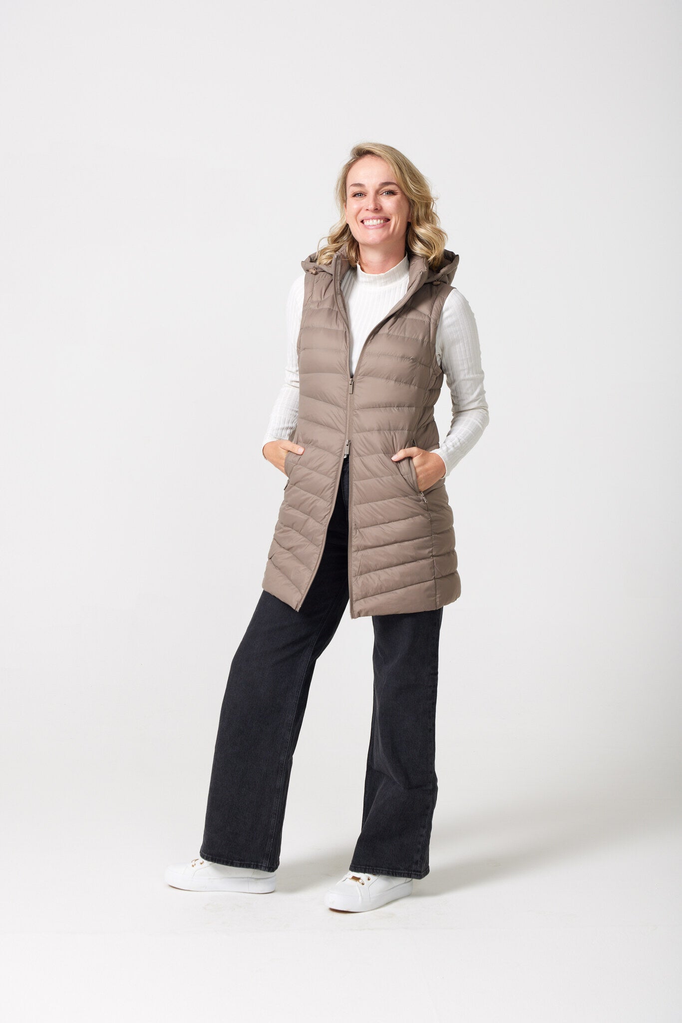 Chai Longline Gilet™ — women’s sleeveless quilted puffer vest in chai brown, extended longline cut with hood, perfect for versatile layering in Australia