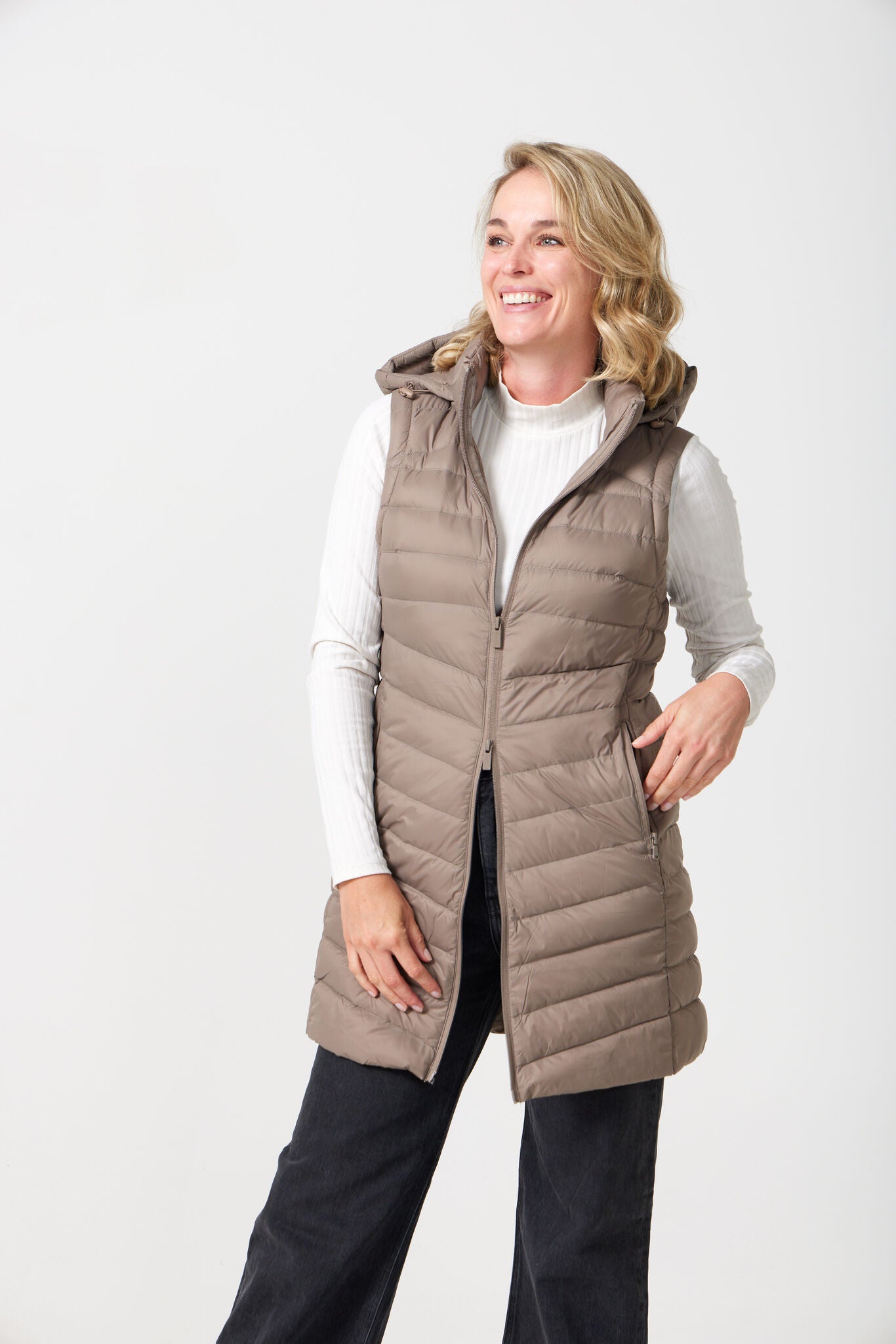 Chai Longline Gilet™ — women’s sleeveless quilted puffer vest in chai brown, extended longline cut with hood, perfect for versatile layering in Australia