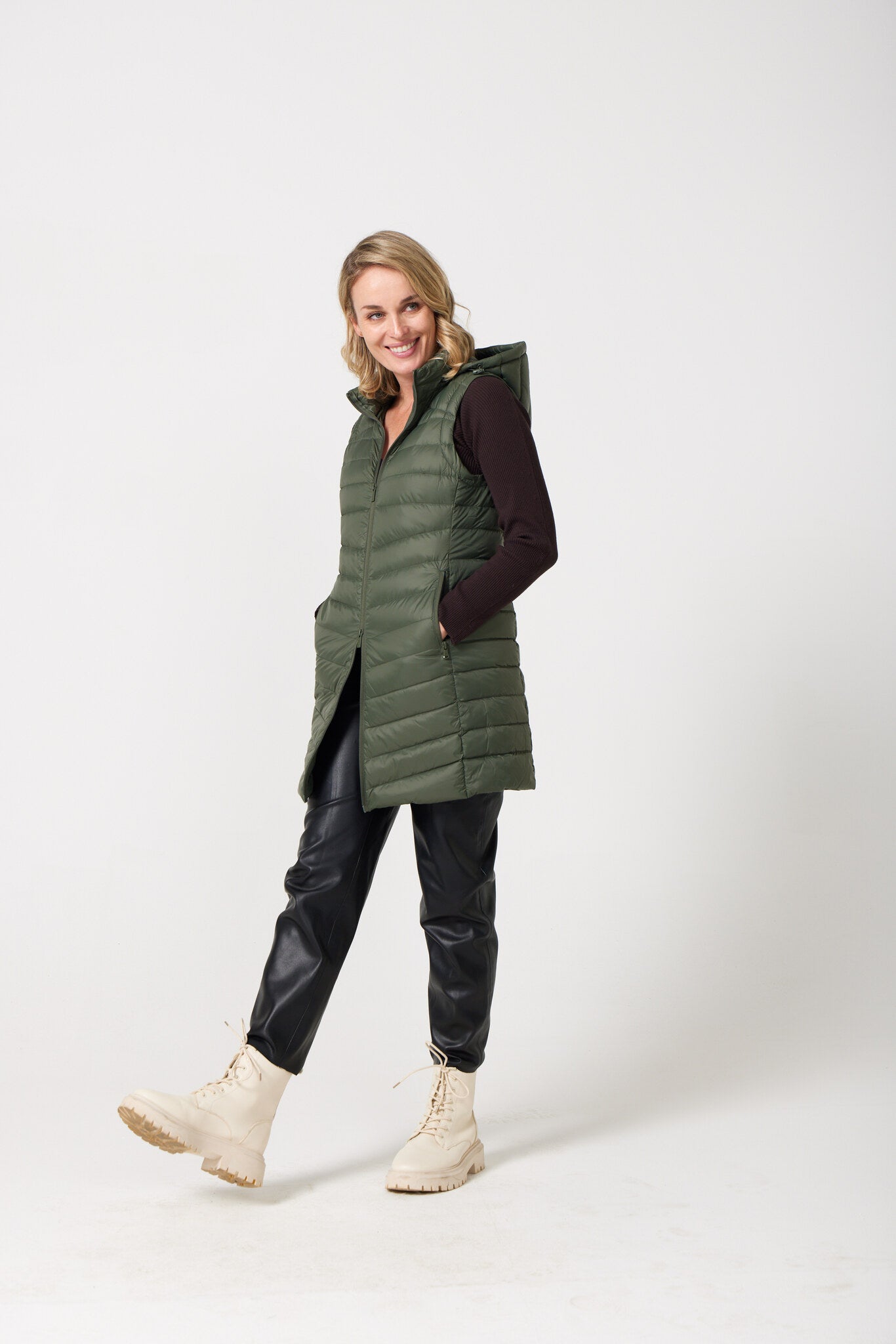 Sage Longline Gilet™ — women’s sleeveless gilet in sage green, extra length with hood, versatile for layering in winter an essential in Australia