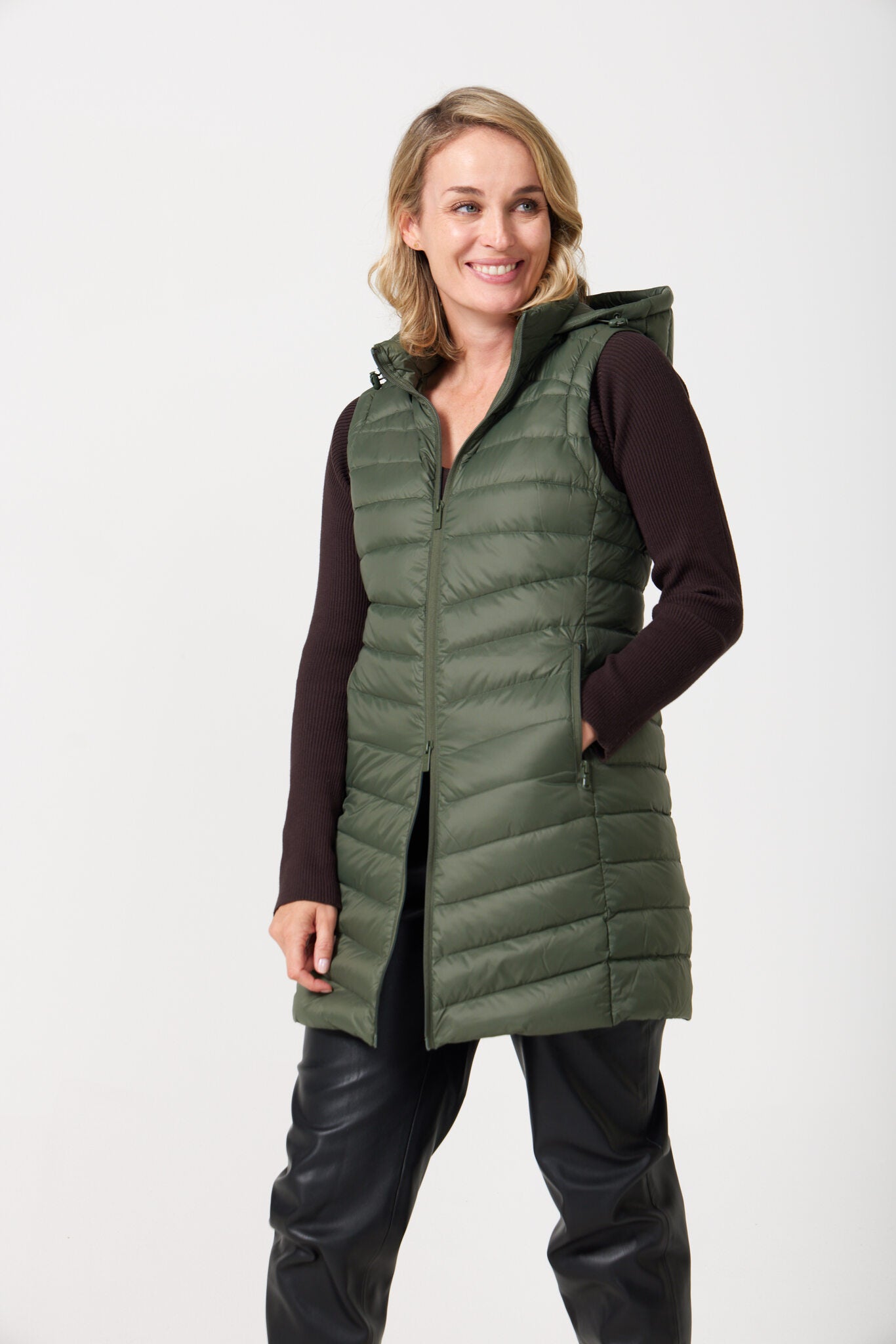 Sage Longline Gilet™ — women’s sleeveless gilet in sage green, extra length with hood, versatile for layering in winter an essential in Australia