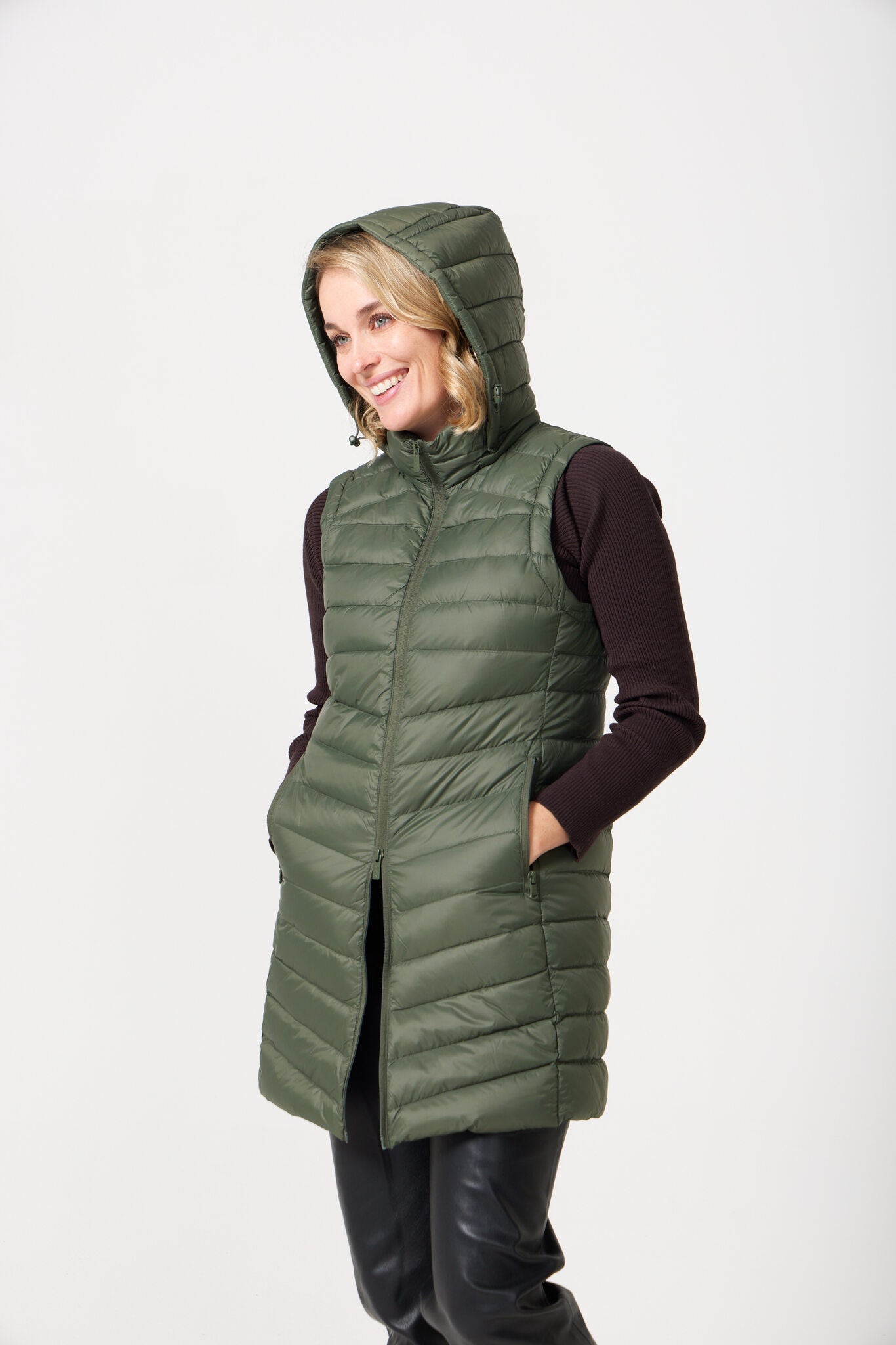 Sage Longline Gilet™ — women’s sleeveless gilet in sage green, extra length with hood, versatile for layering in winter an essential in Australia