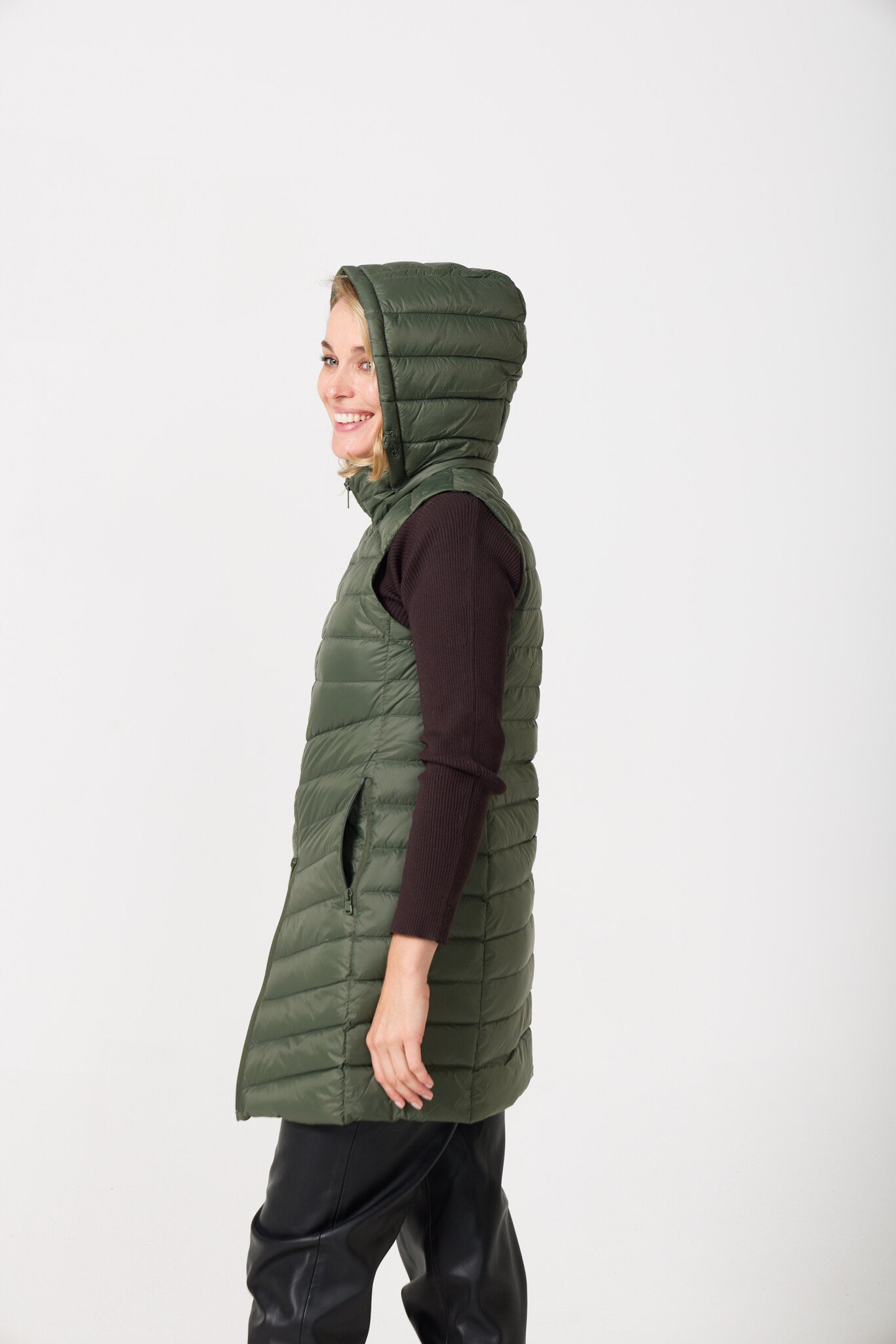 Sage Longline Gilet™ — women’s sleeveless gilet in sage green, extra length with hood, versatile for layering in winter an essential in Australia