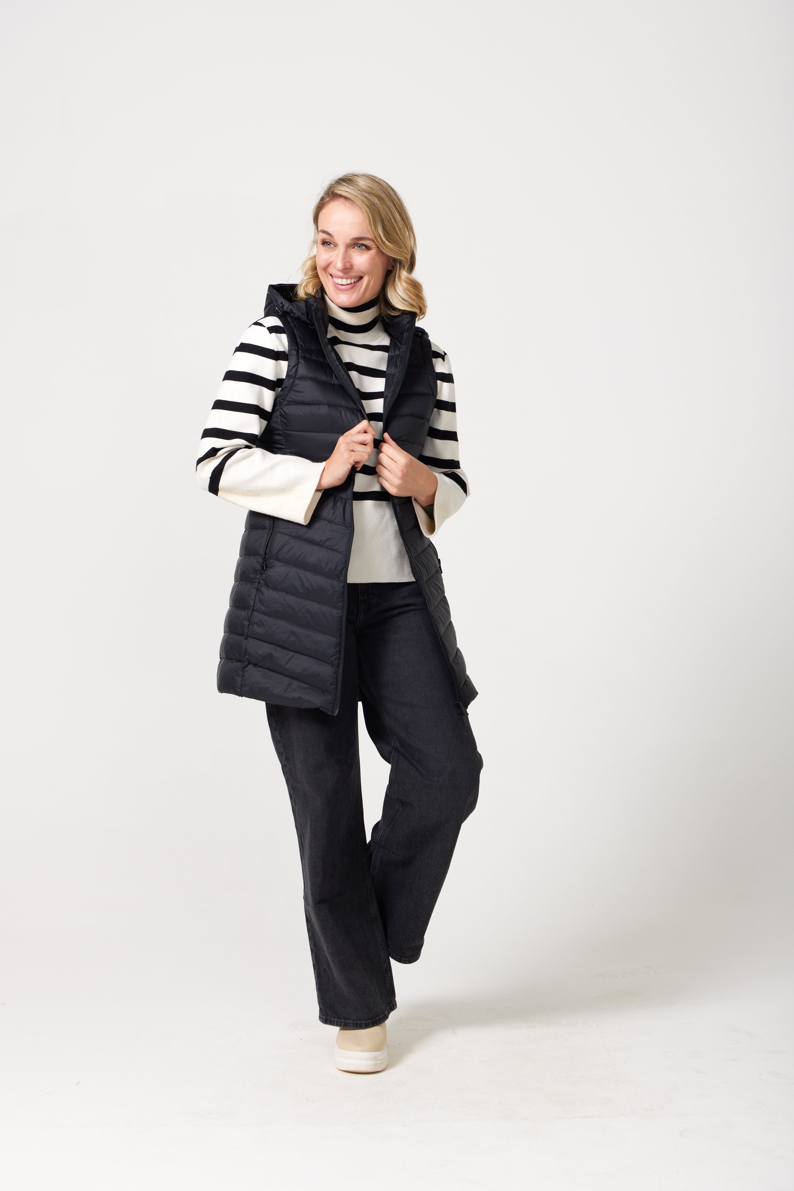 Midnight Longline Gilet™ — women’s sleeveless gilet in black, longline cut with hood, versatile layering piece for winter in Australia