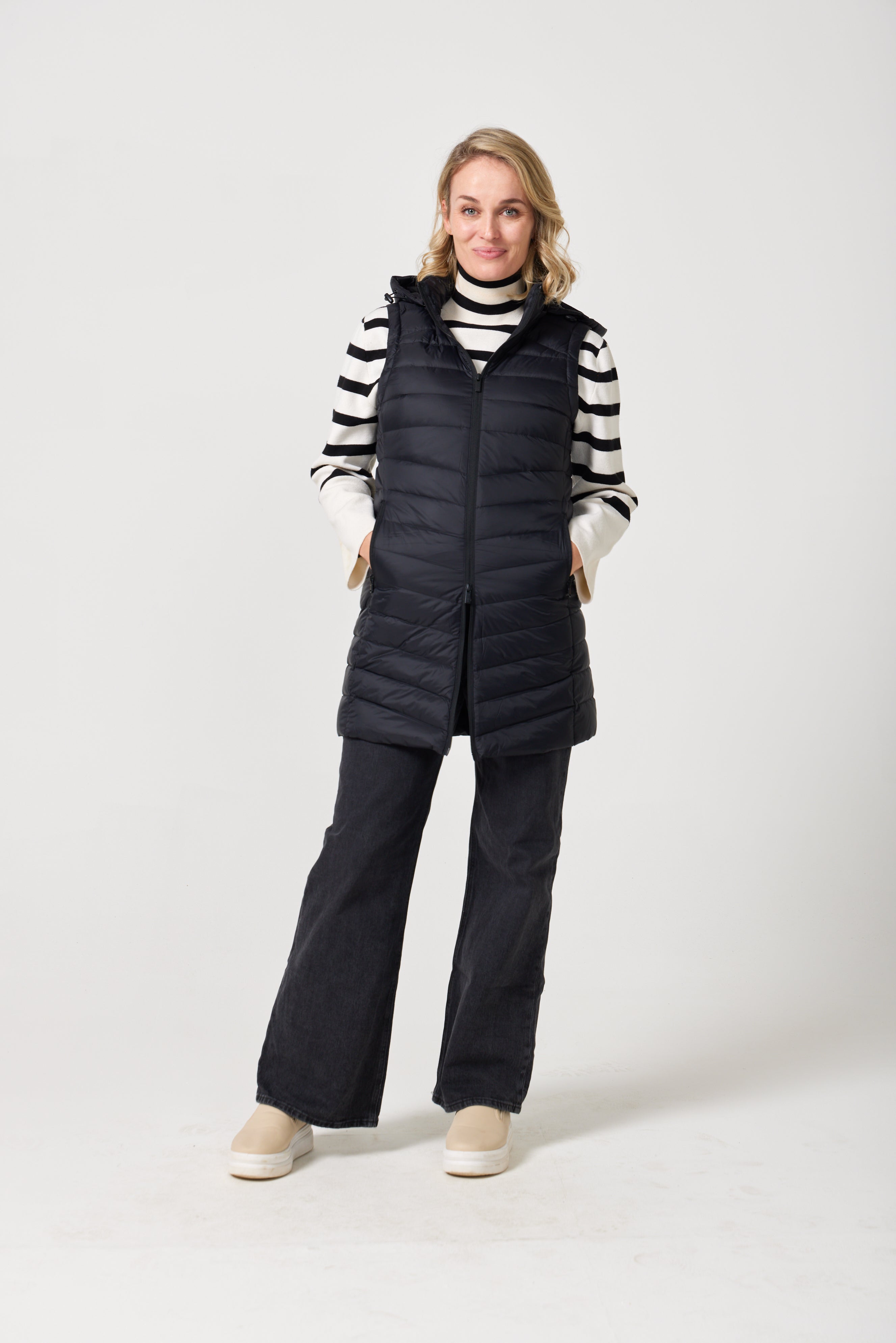 Midnight Longline Gilet™ — women’s sleeveless gilet in black, longline cut with hood, versatile layering piece for winter in Australia