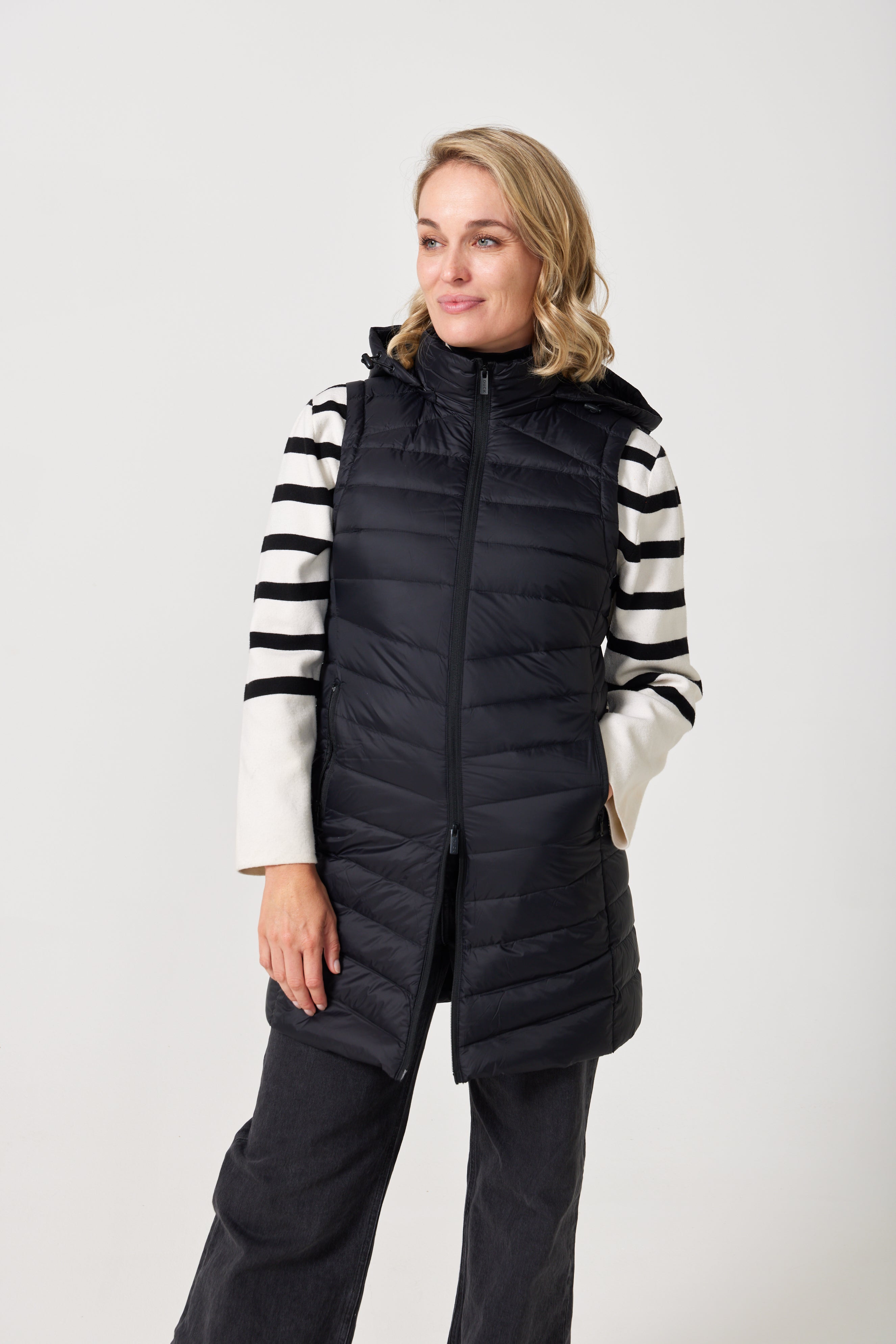Midnight Longline Gilet™ — women’s sleeveless gilet in black, longline cut with hood, versatile layering piece for winter in Australia