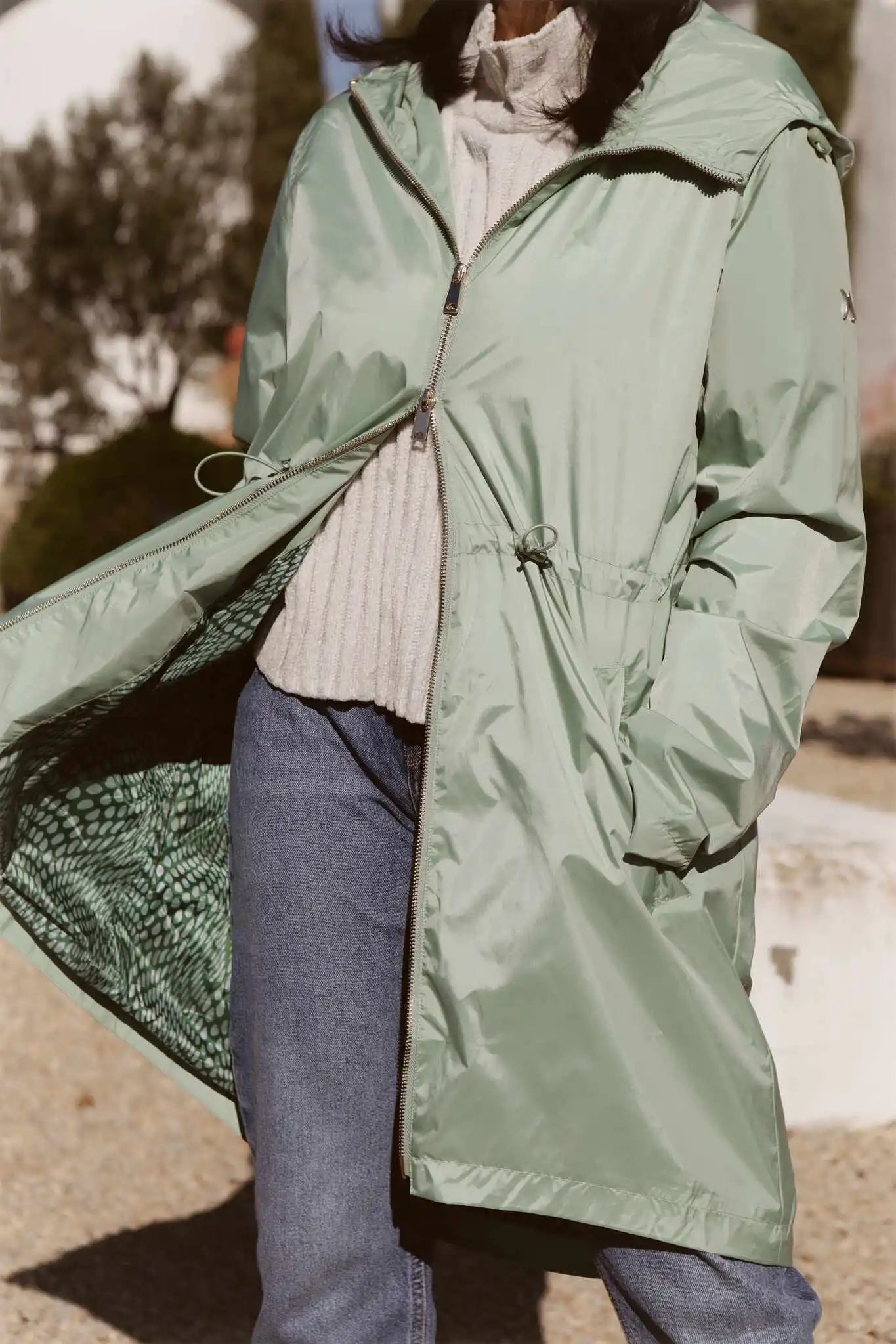Madame Verde Vol 1 mint green hooded raincoat, lightweight waterproof jacket perfect for wet weather in Australia.