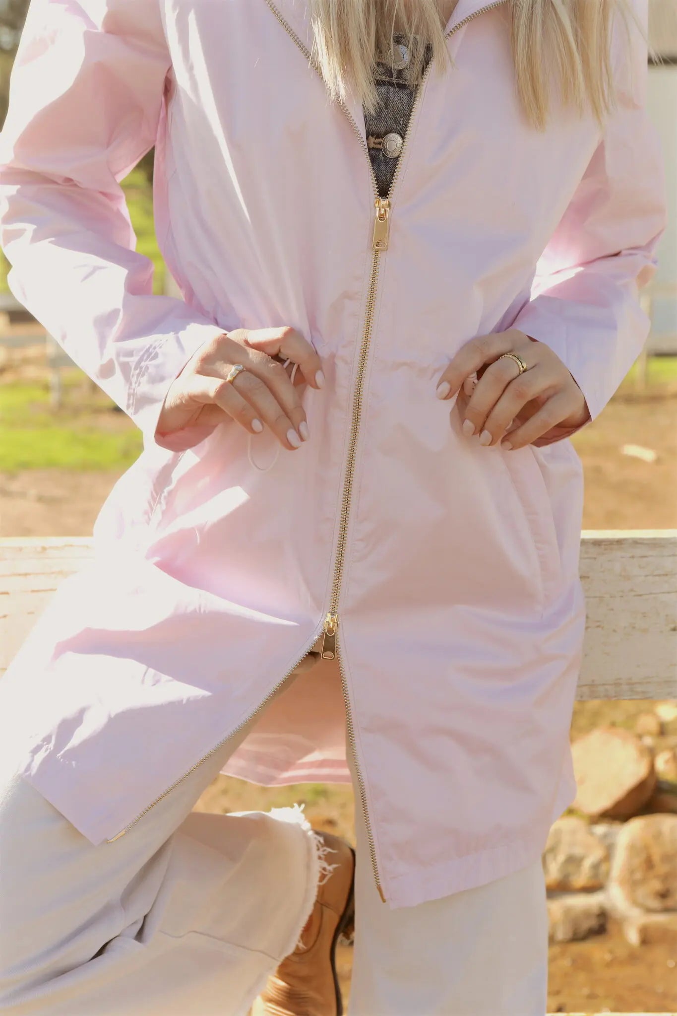 Rosewater Mist pastel pink hooded raincoat, modern lightweight waterproof raincoat perfect for wet weather in Australia.