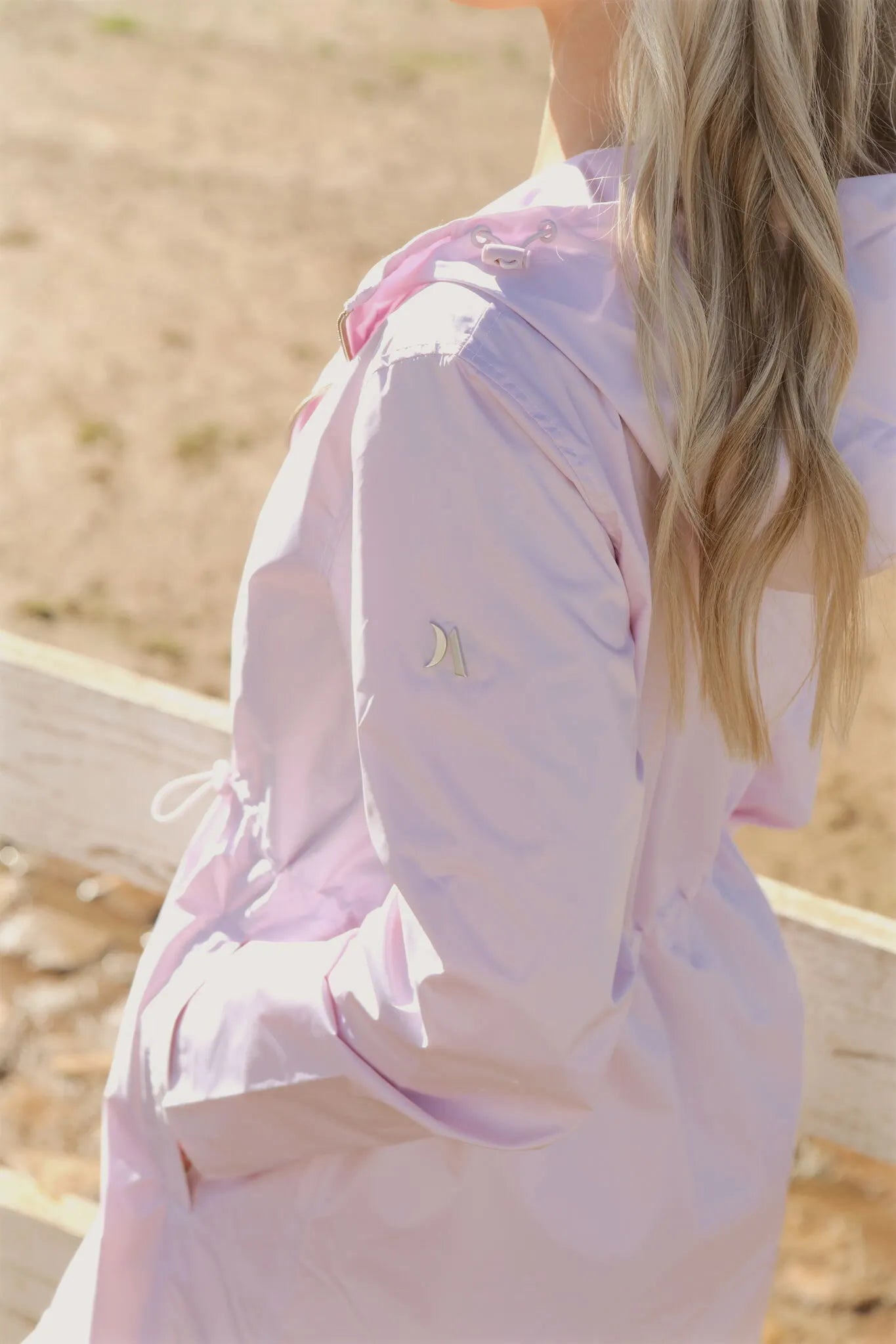 Rosewater Mist pastel pink hooded raincoat, modern lightweight waterproof raincoat perfect for wet weather in Australia.