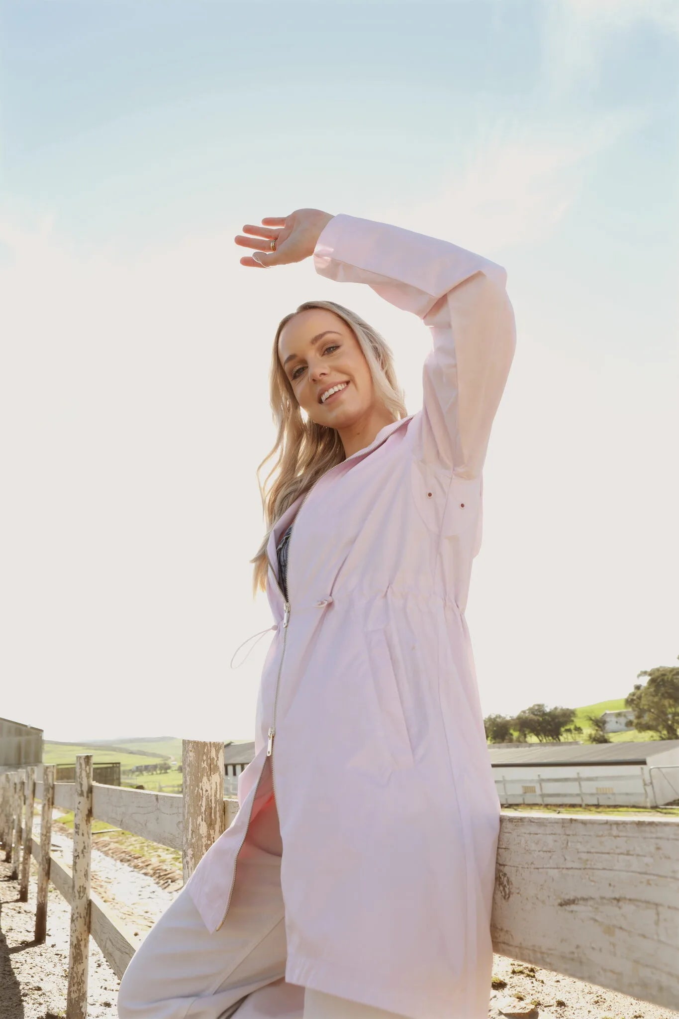 Rosewater Mist pastel pink hooded raincoat, modern lightweight waterproof raincoat perfect for wet weather in Australia.