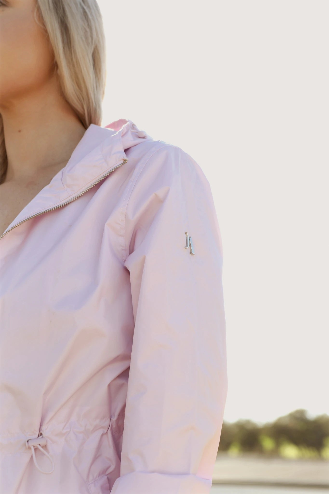 Rosewater Mist pastel pink hooded raincoat, modern lightweight waterproof raincoat perfect for wet weather in Australia.