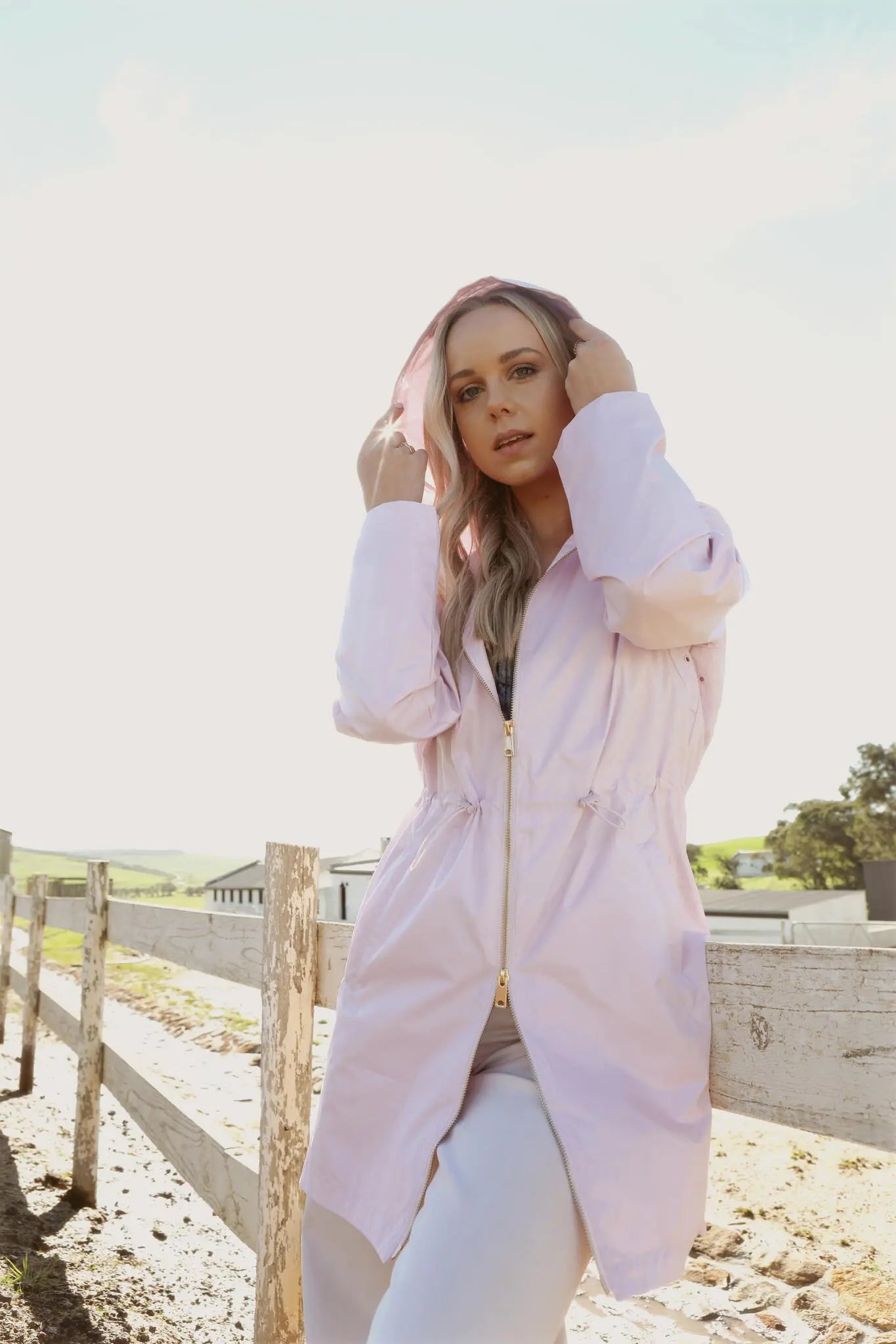 Rosewater Mist pastel pink hooded raincoat, modern lightweight waterproof raincoat perfect for wet weather in Australia.