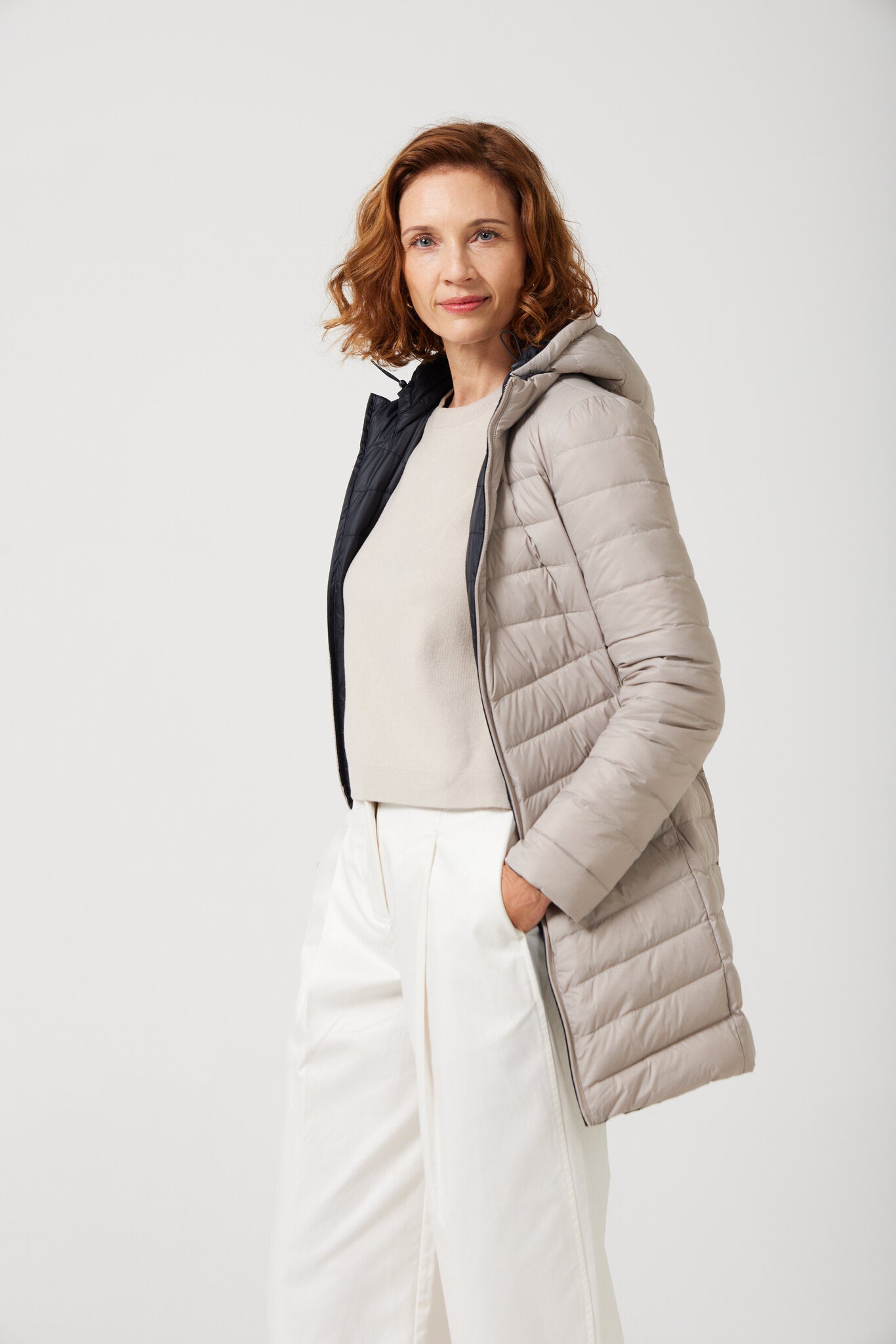 Women’s ebony black and ivory reversible insulated parka with hood, warm winter parka perfect for layering in Australia’s cooler weather — Ebony x Ivory Classic Parka™