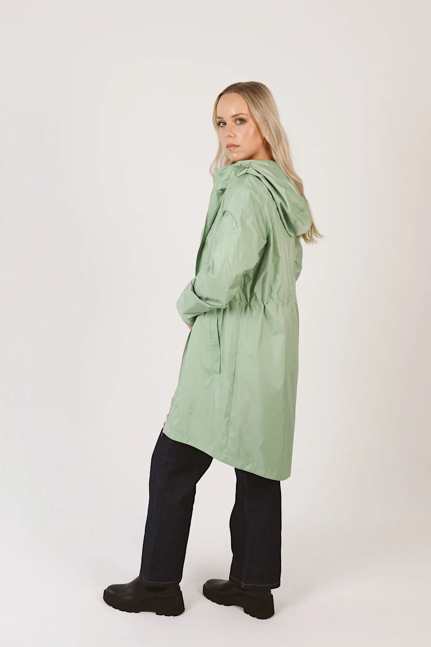 Madame Verde Vol 1 mint green hooded raincoat, lightweight waterproof jacket perfect for wet weather in Australia.