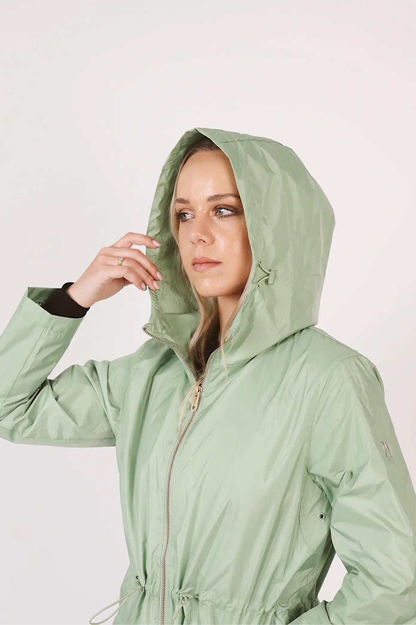 Madame Verde Vol 1 mint green hooded raincoat, lightweight waterproof jacket perfect for wet weather in Australia.