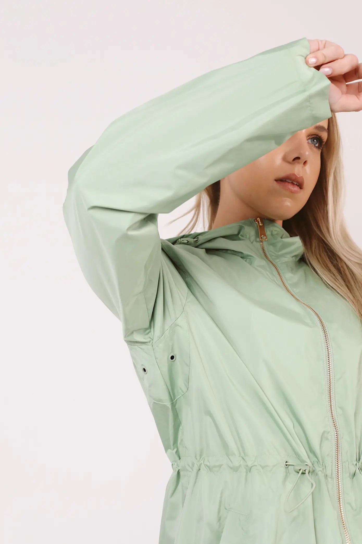 Madame Verde Vol 1 mint green hooded raincoat, lightweight waterproof jacket perfect for wet weather in Australia.