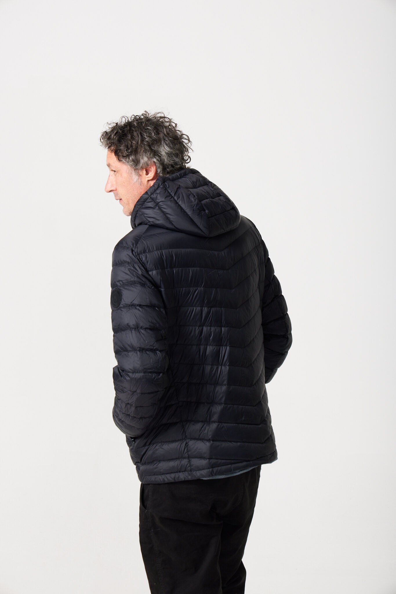 Men’s Black Classic Jacket™ in black, versatile lightweight puffer jacket with hood for everyday wear in Australia
