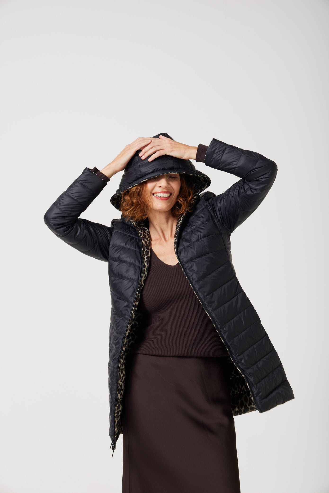 Women’s leopard print and midnight black reversible insulated parka with hood, warm winter parka perfect for layering in Australia’s cooler weather — Midnight x Leopard Classic Parka™