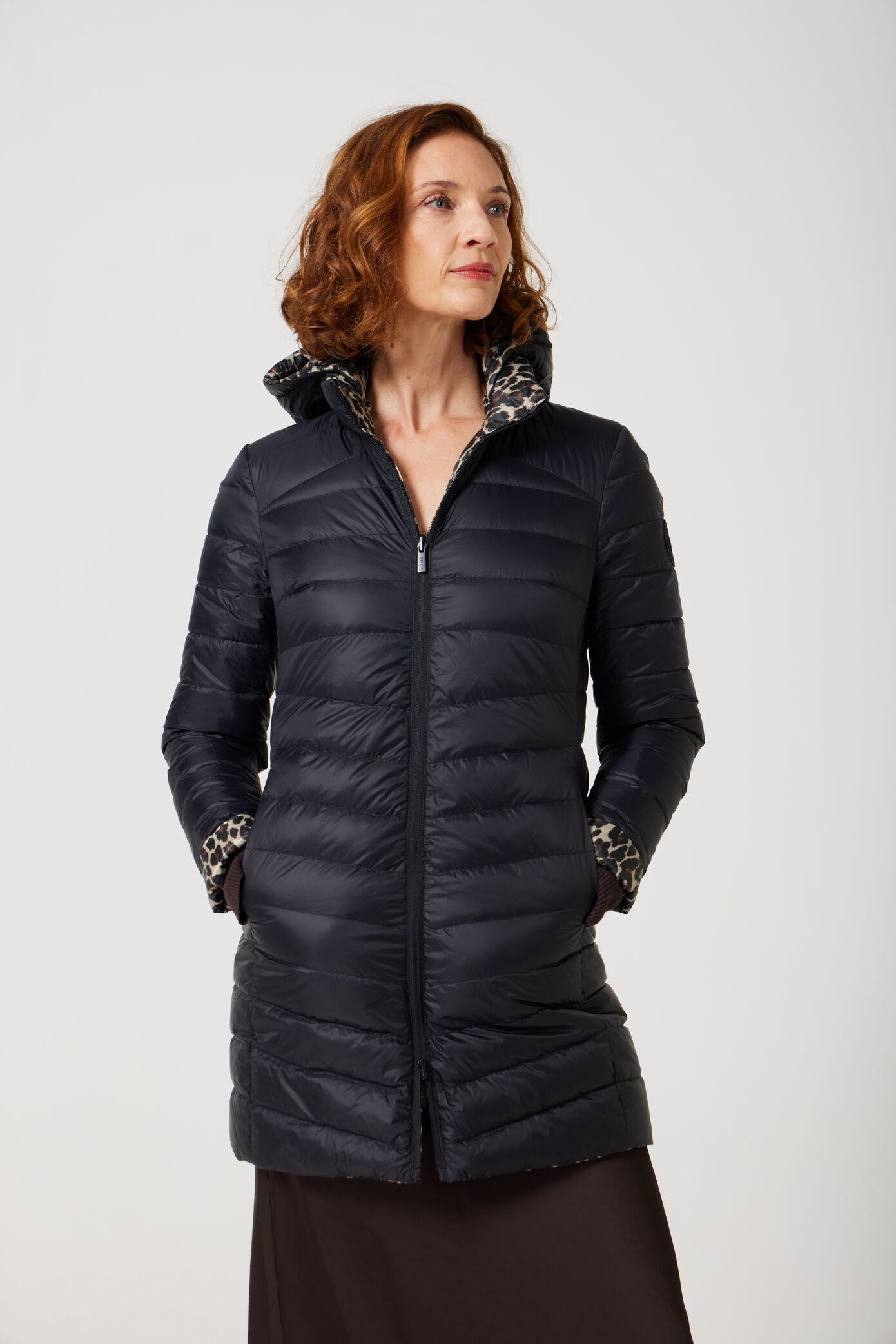 Women’s leopard print and midnight black reversible insulated parka with hood, warm winter parka perfect for layering in Australia’s cooler weather — Midnight x Leopard Classic Parka™