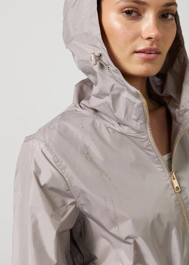 The Cairo Sands beige hooded raincoat, modern lightweight waterproof raincoat perfect for Australia’s weather and rain