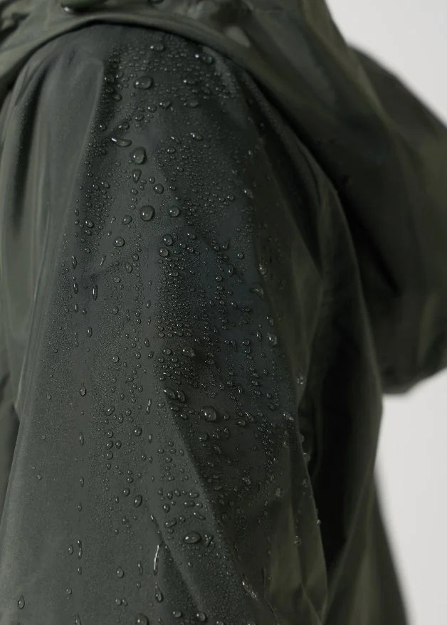 The Juniper deep green hooded raincoat, modern lightweight waterproof raincoat perfect for Australia’s changing weather and rain