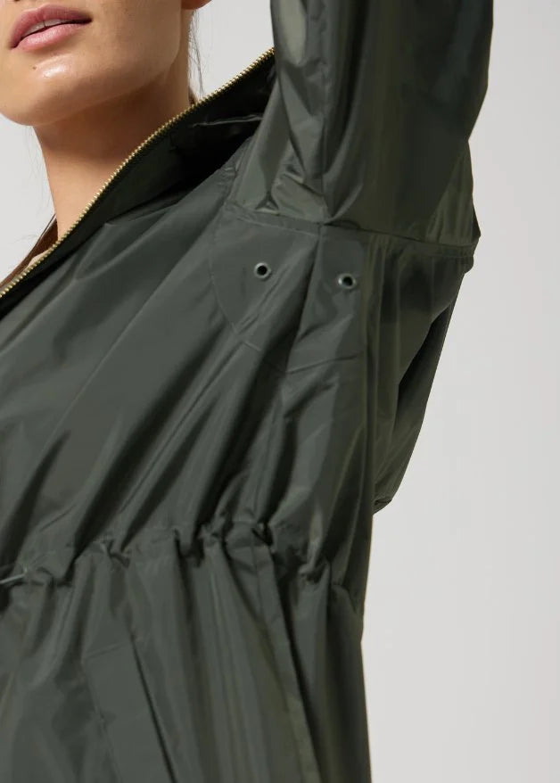 The Juniper deep green hooded raincoat, modern lightweight waterproof raincoat perfect for Australia’s changing weather and rain