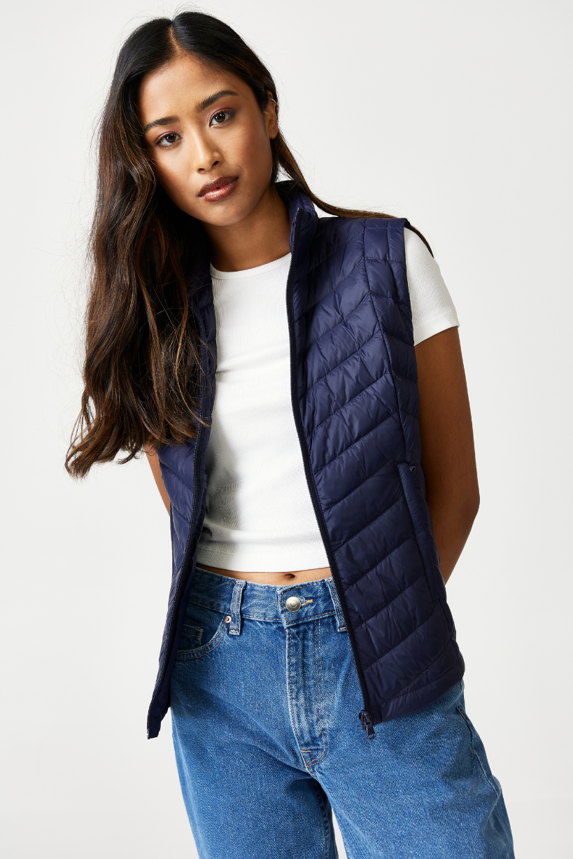 Navy Classic Gilet™ — a sleeveless, lightweight quilted gilet in deep navy blue