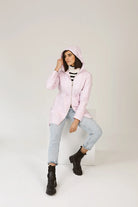 Rosewater Mist pastel pink hooded raincoat, modern lightweight waterproof raincoat perfect for wet weather in Australia.