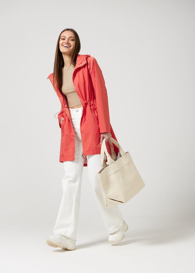 The Coral Spritz coral red hooded raincoat, modern lightweight waterproof raincoat perfect for Australia’s changing weather and rain