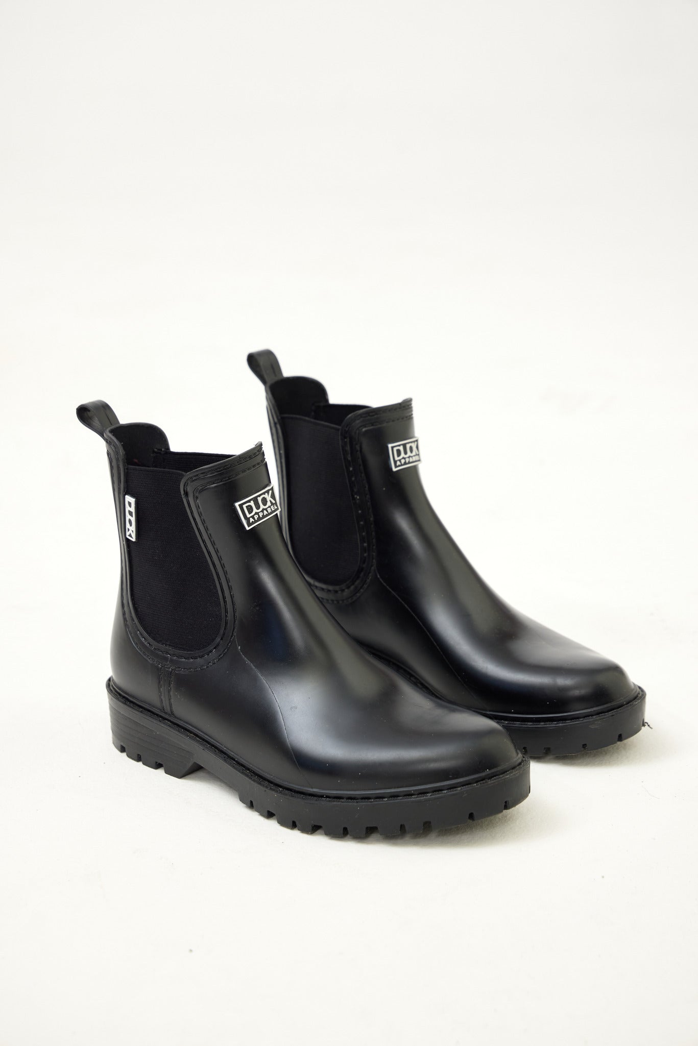 Black Ankle-length gumboots with elastic side panels and durable sole, designed for everyday outdoor and wet-weather use