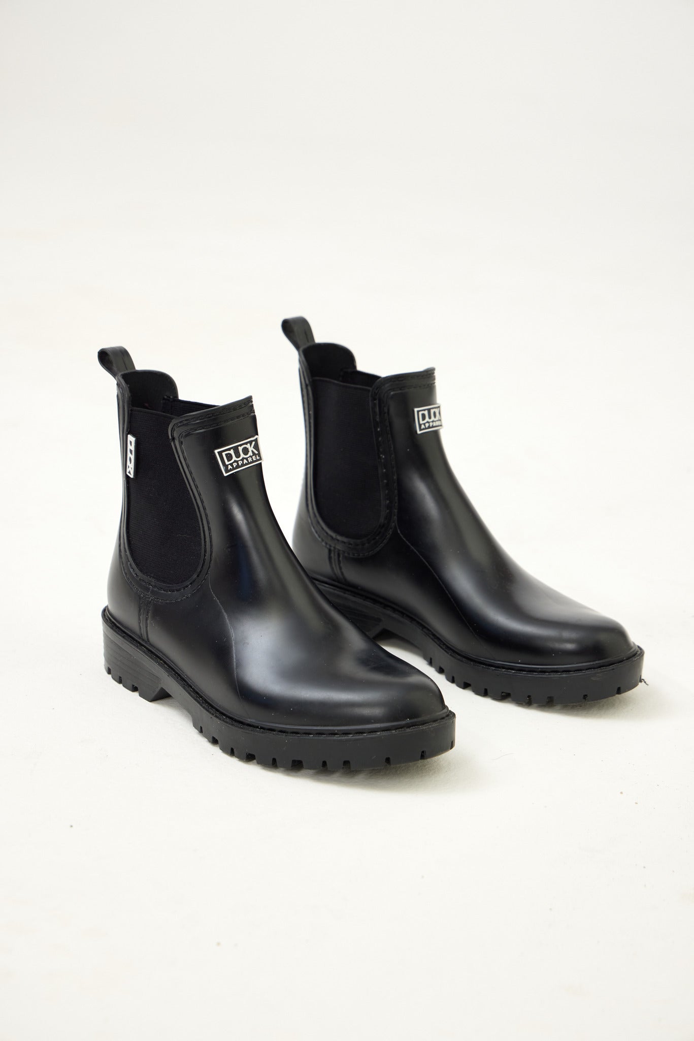 Black Ankle-length gumboots with elastic side panels and durable sole, designed for everyday outdoor and wet-weather use