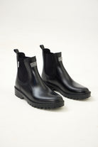 Black Ankle-length gumboots with elastic side panels and durable sole, designed for everyday outdoor and wet-weather use