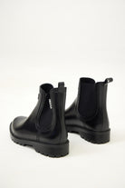 Black Ankle-length gumboots with elastic side panels and durable sole, designed for everyday outdoor and wet-weather use