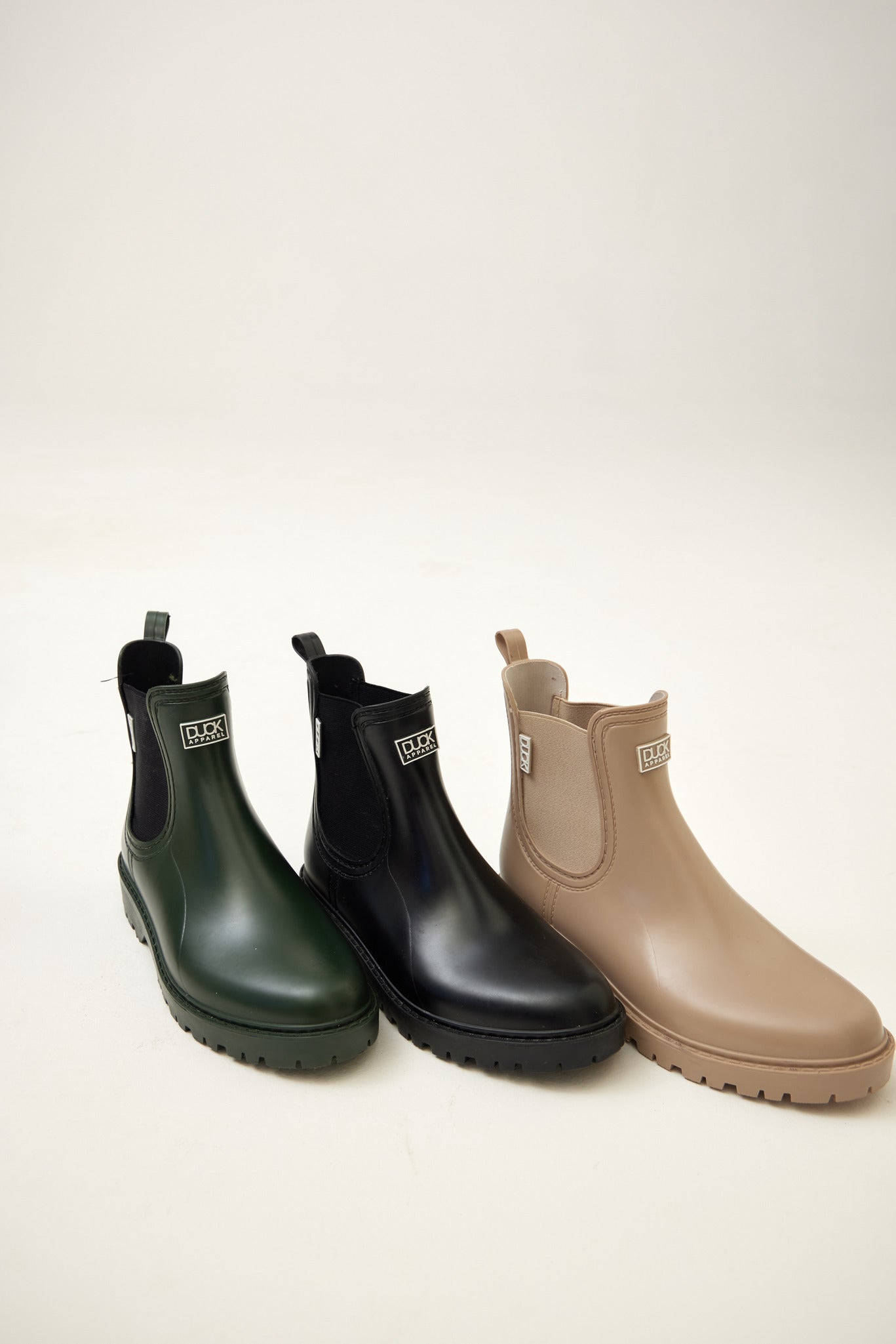 Ankle-length gumboots with elastic side panels and durable sole, designed for everyday outdoor and wet-weather use