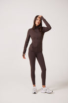 Brown Lightweight performance jacket with a smooth, sculpting fit, full zip front, high collar, and stretch fabric designed for everyday movement and layering.