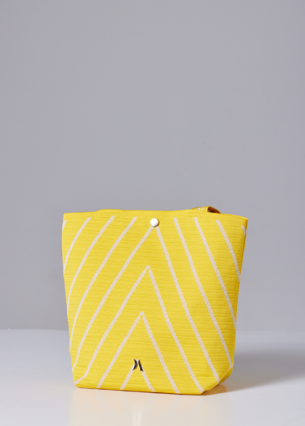 Yellow woven handbag with white diagonal stripe design, lightweight eco-friendly fabric tote bag with sturdy handles for everyday use