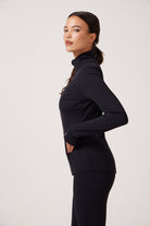 Black Lightweight performance jacket with a smooth, sculpting fit, full zip front, high collar, and stretch fabric designed for everyday movement and layering.