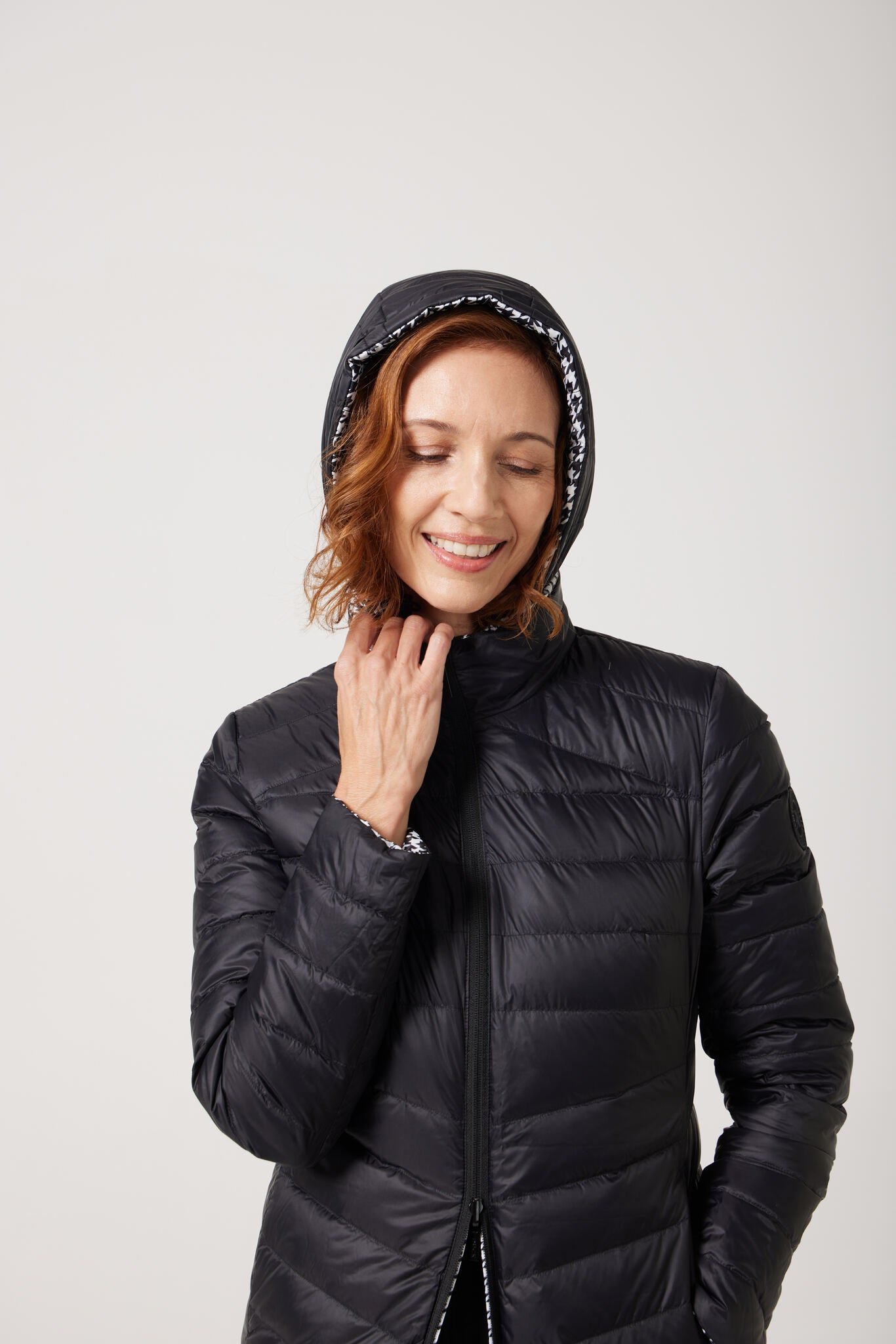 Women’s houndstooth print and midnight black reversible insulated parka with hood, warm winter parka perfect for layering in Australia’s cooler weather — Midnight x Houndstooth Classic Parka™