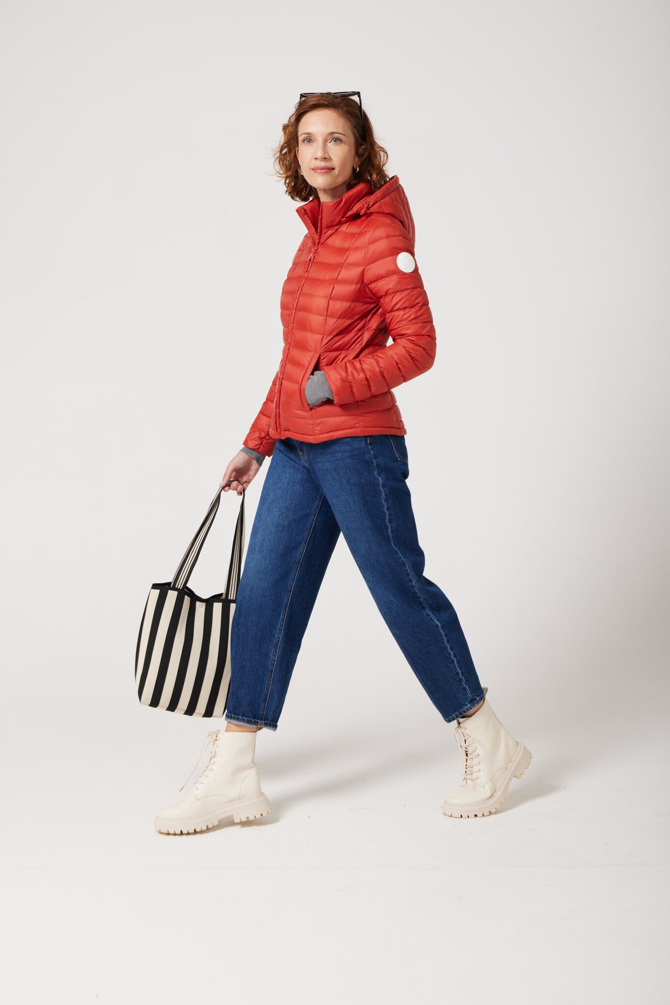 Women’s Rust Classic Jacket™ in vibrant red, stylish lightweight puffer jacket for everyday wear and seasonal outerwear in Australia